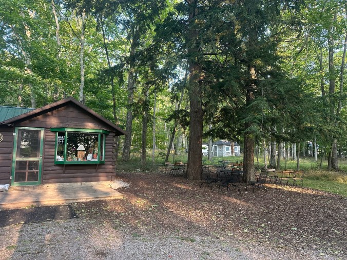 Trillium Woods Coffee low building set in tall pine trees